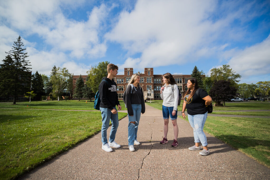 Students chatting in front of Old Main