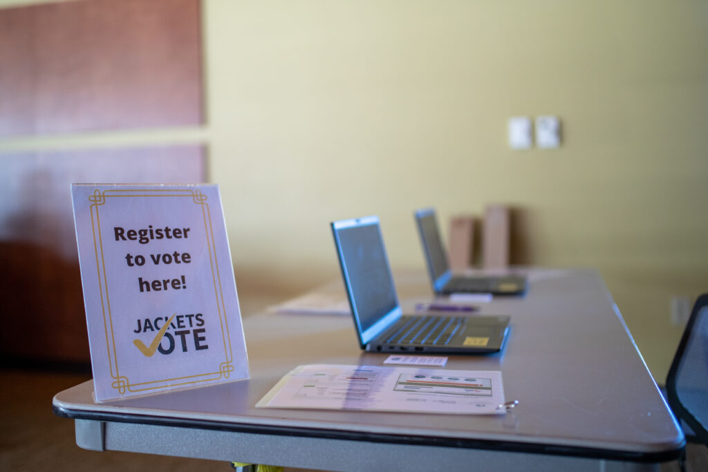 Sign that reads "Register to vote here! Jackets Vote"