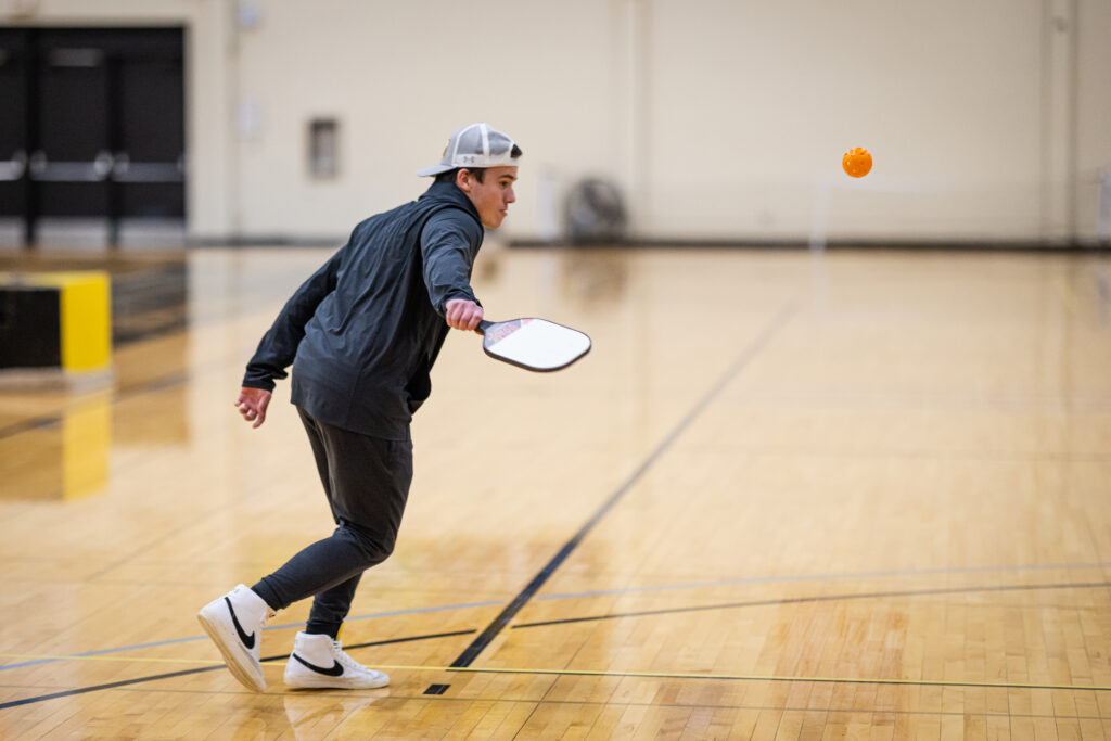 Student playing pickleball