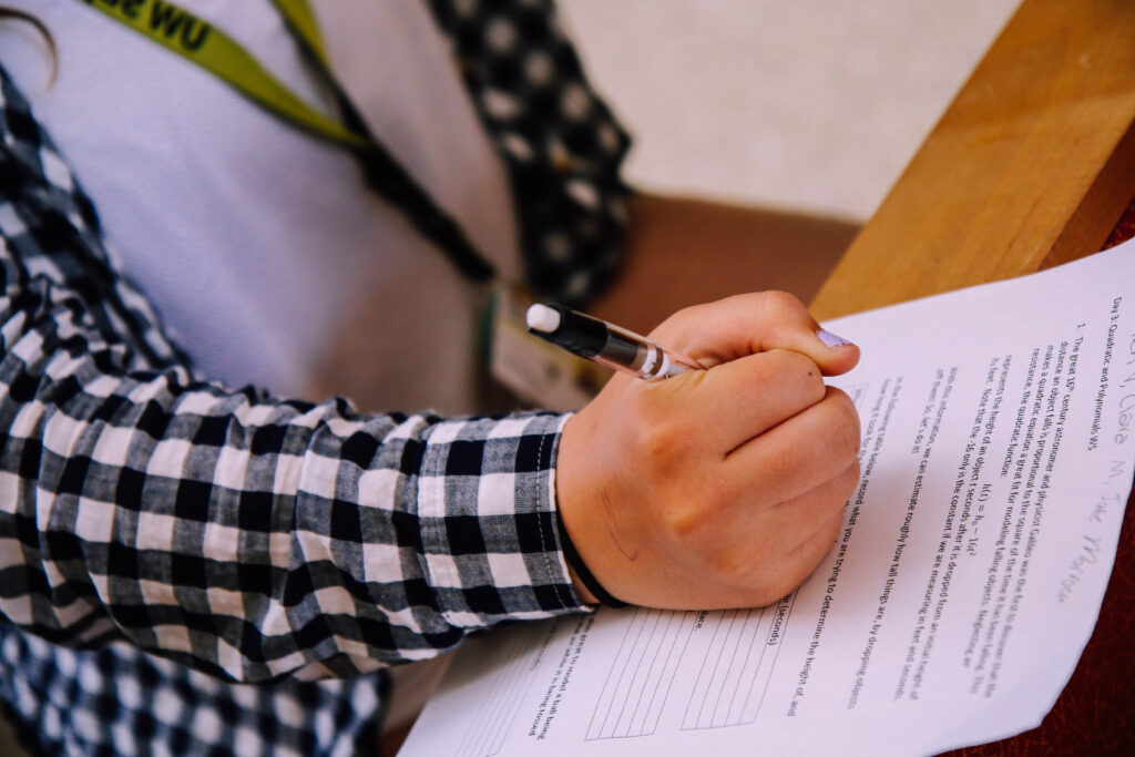 Picture of a student writing an assignment