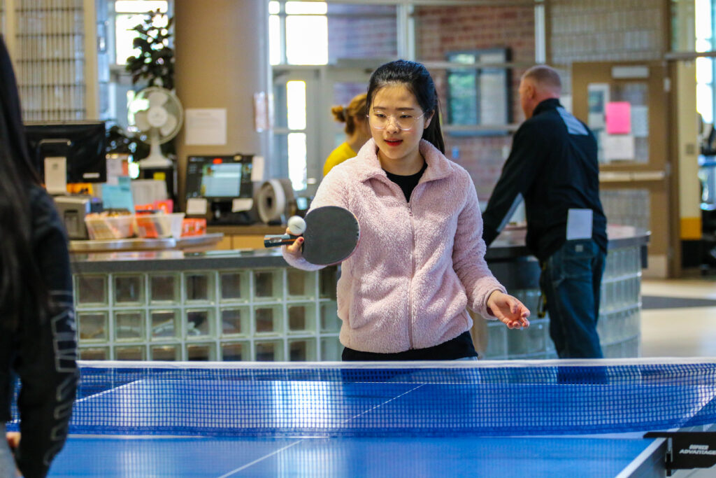 Students playing ping pong