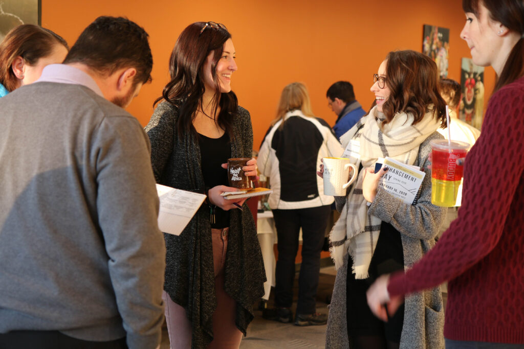 Faculty and staff mingling