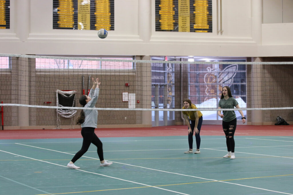 Students playing volleyball