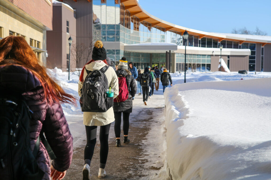 Students walking to YU