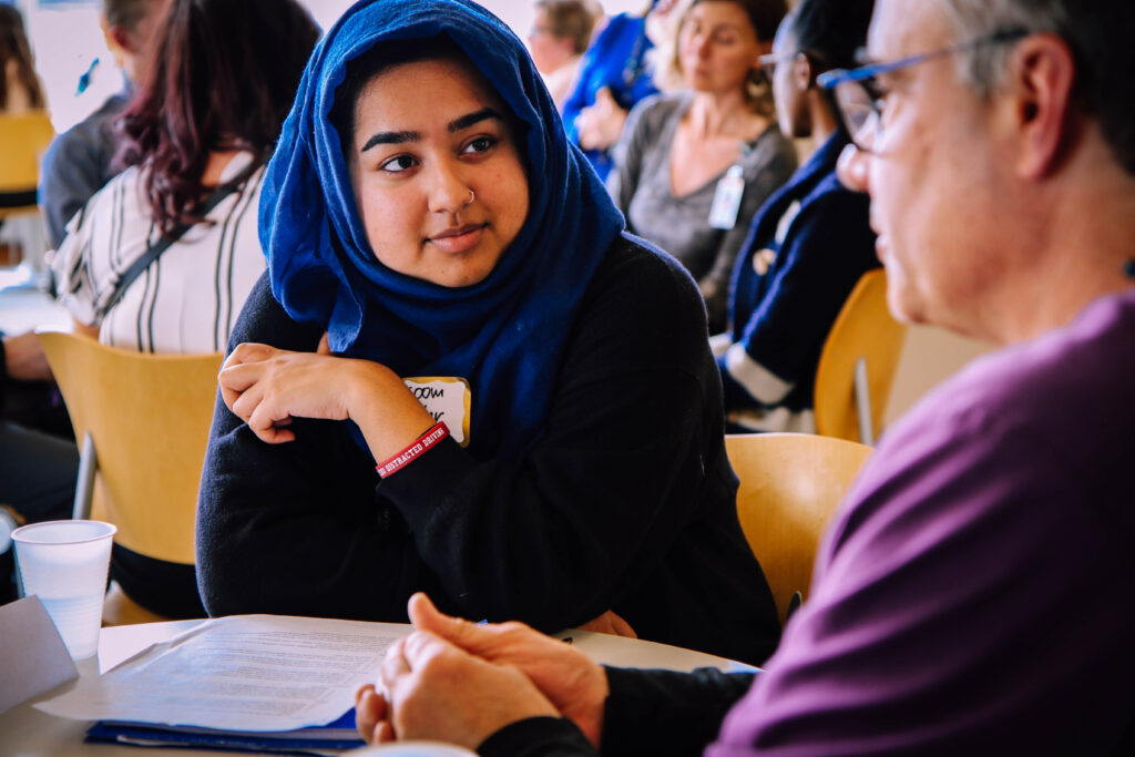 Picture of a student talking with a professional