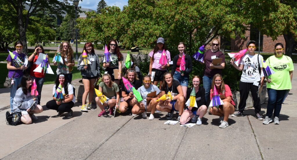 High school students holding rockets