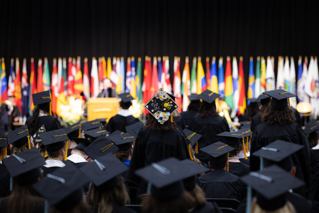 UW-Superior graduation caps at ceremony