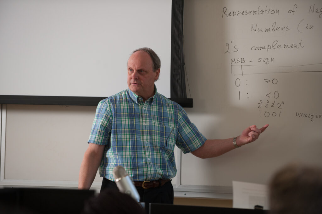 Professor teaching with a whiteboard