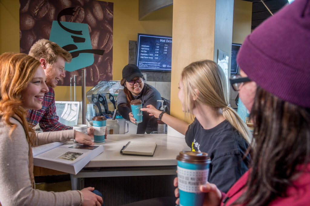 Students grabbing coffee at Caribou Coffee