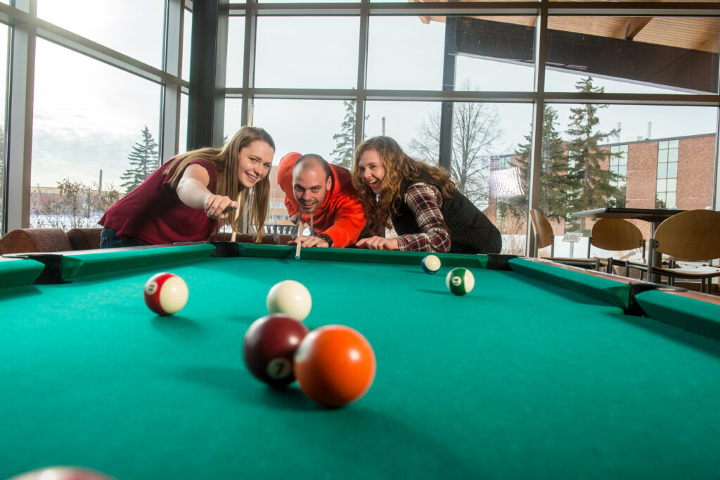 Students playing pool