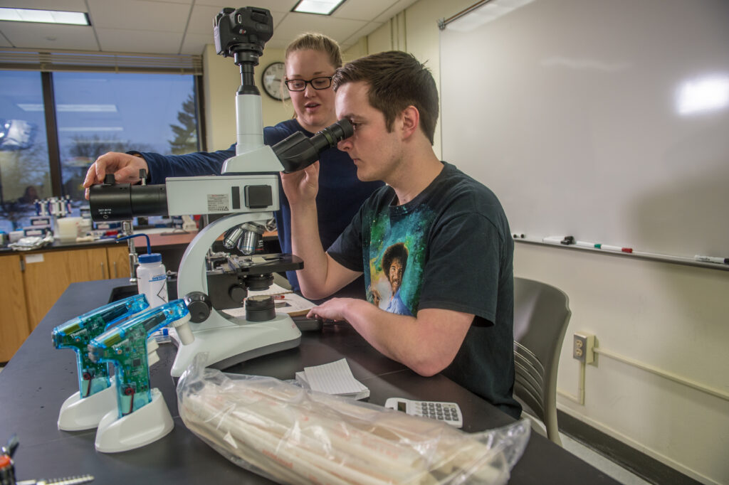 Students using microscope