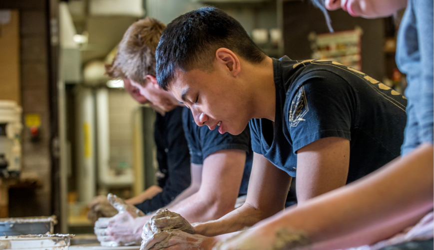 Students working with clay