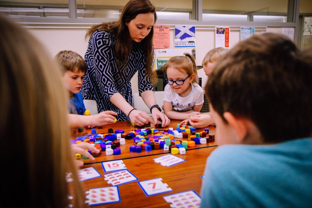 UW-Superior student teaching a group of children