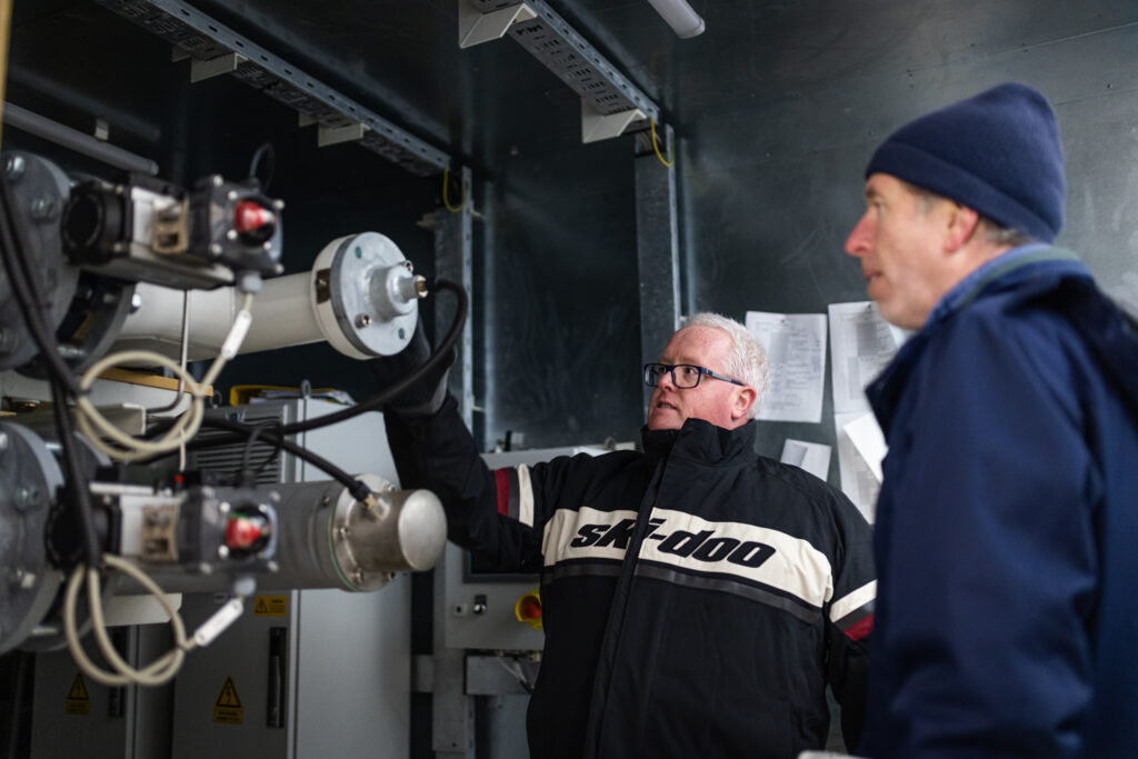 Men examining machinery