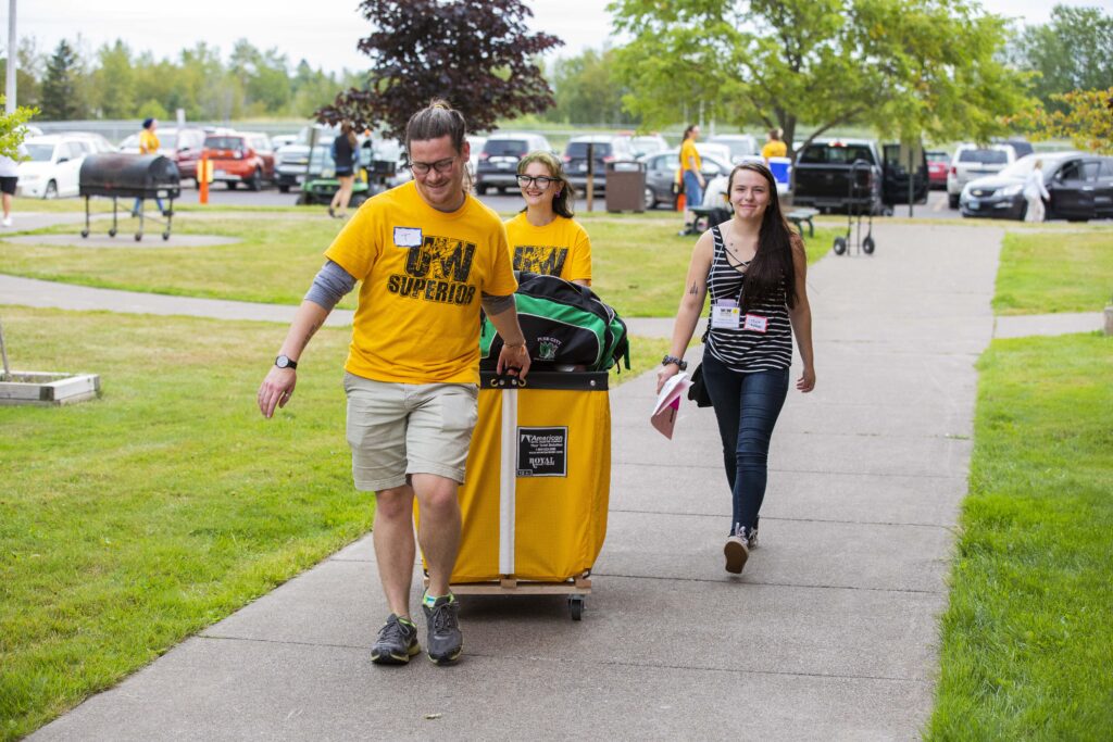 Move-in staff helping student