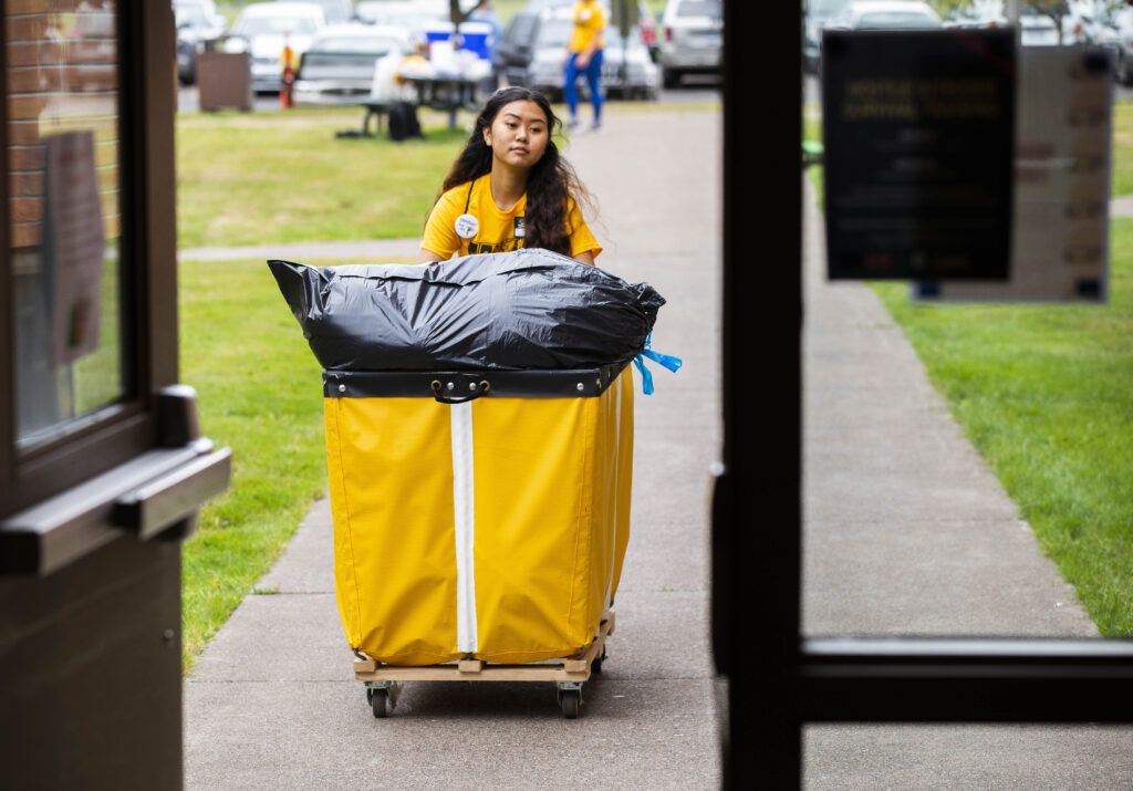 Move-in staff helping student