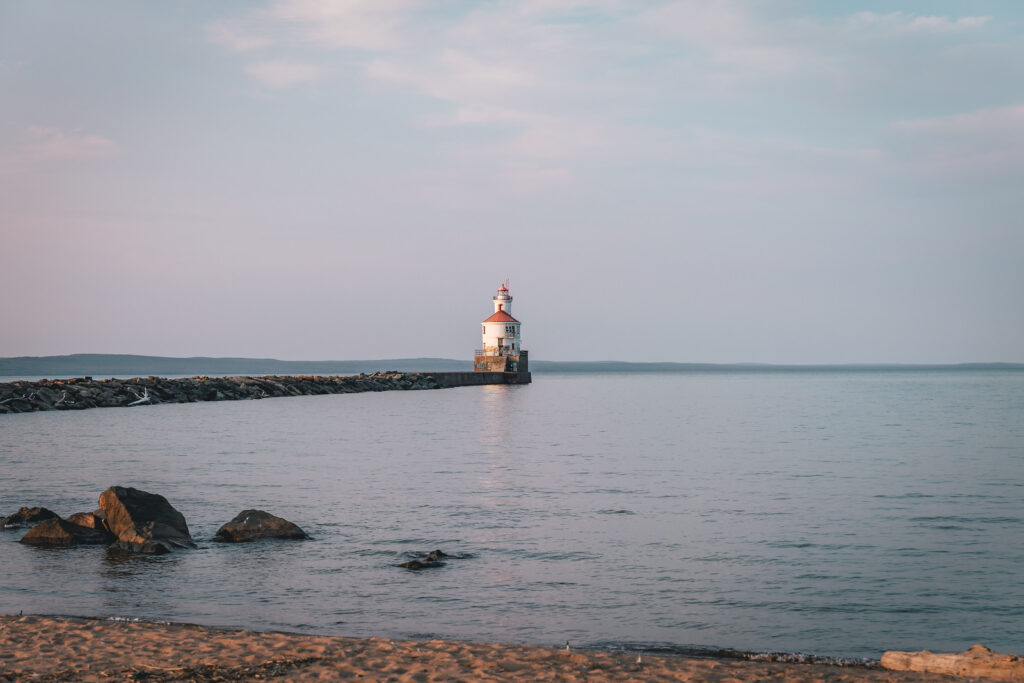 Lighthouse overlooking body of water